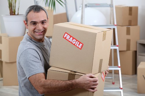 Customer loading items into a van during a man and van service