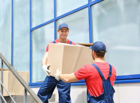 Team preparing a safe man and van move with care and equipment