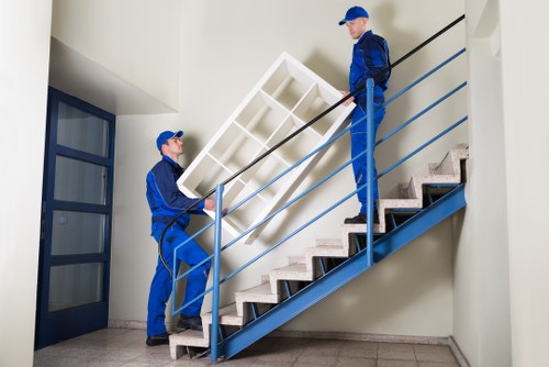 Careful moving team handling furniture during a Brompton home move