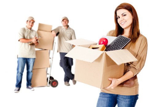 Professional moving team handling boxes and items in Brompton