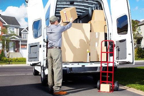 Office furniture and boxed equipment ready for a Brompton commercial move