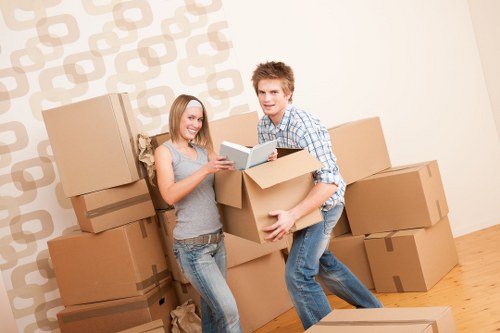 Packed household boxes and furniture ready for transport during a Brompton move