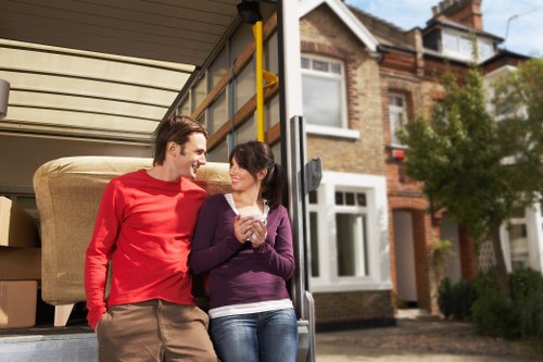 Local movers handling office furniture in a Brompton street