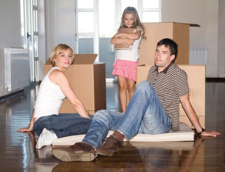 Unloading household belongings into a new home in Brompton